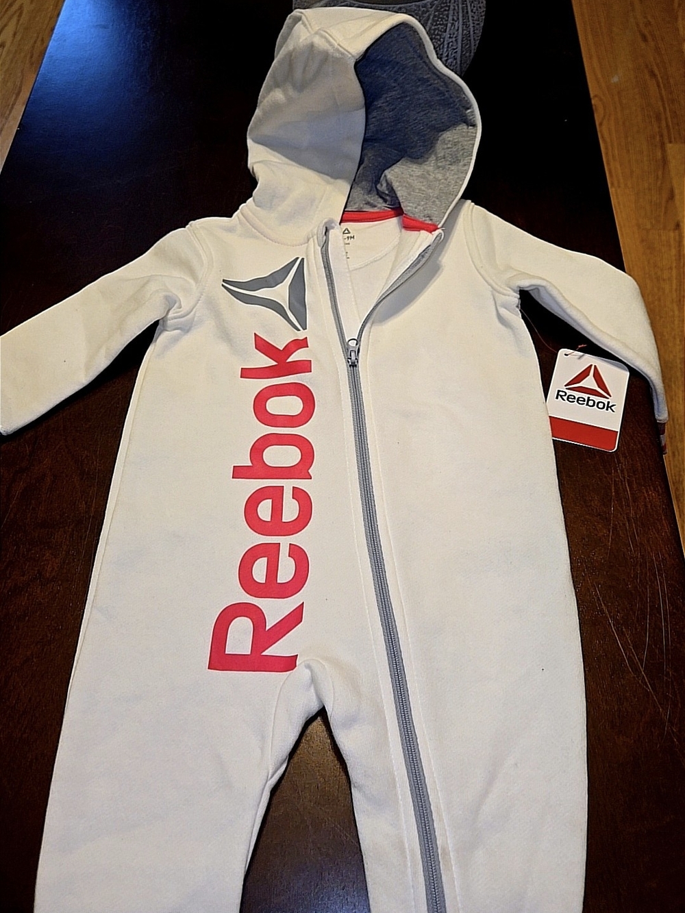 Reebok Kids Cream One-Piece with Pink Logo and Gray Accents